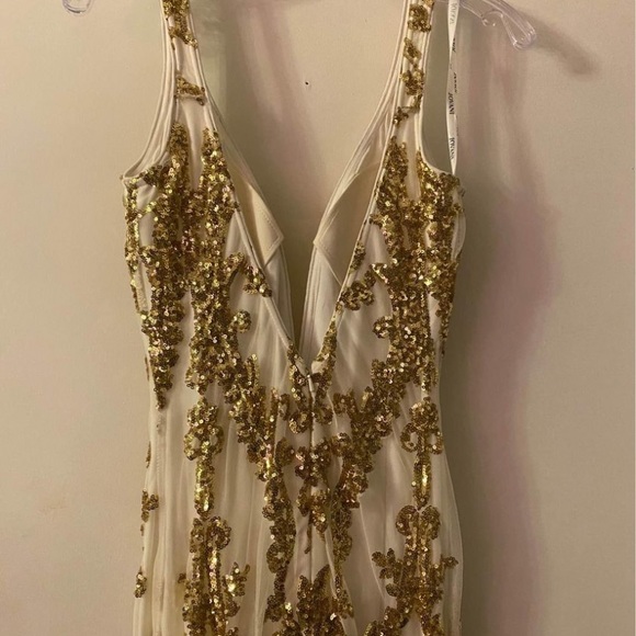 Two prom dresses never worn. Blue is size 4, gold is size 0. Still in bags - Picture 8 of 9